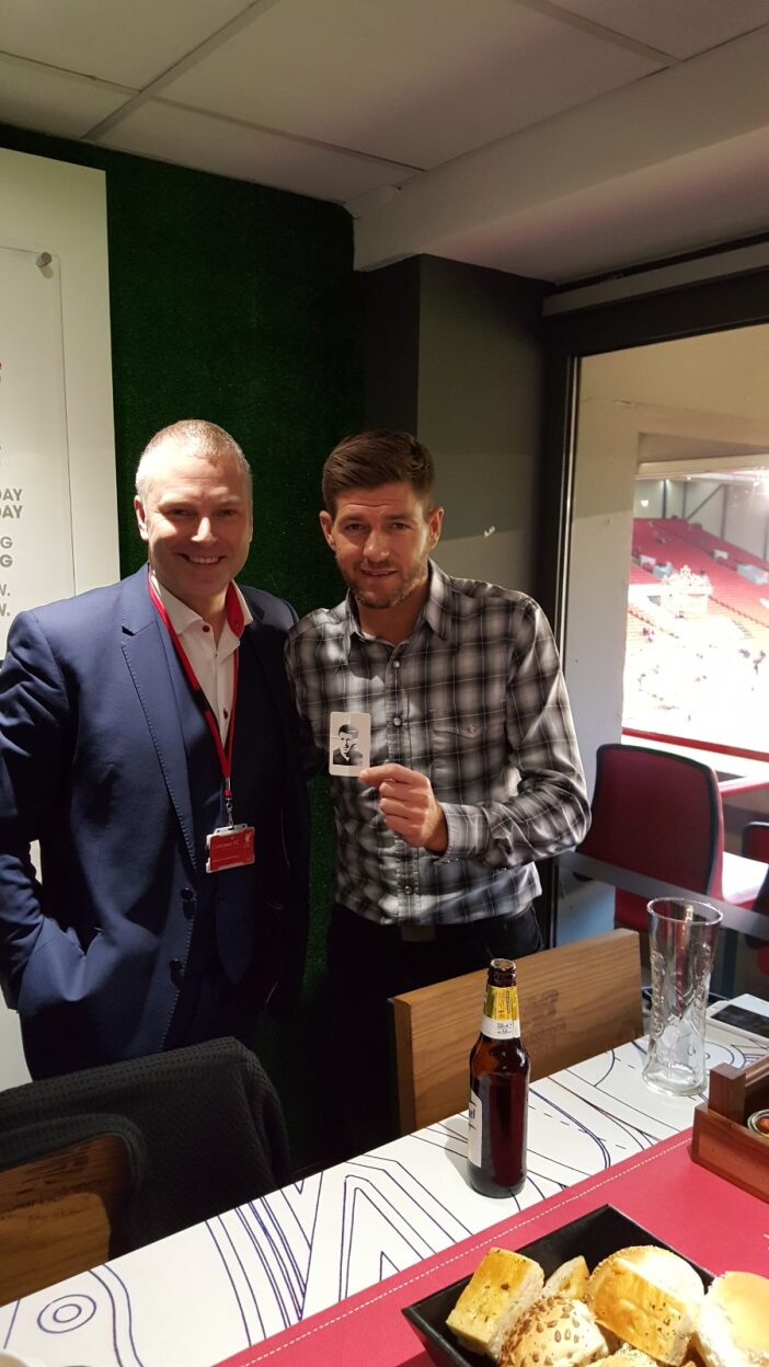 Spencer Lynch performing close-up magic at Anfield hospitality suite